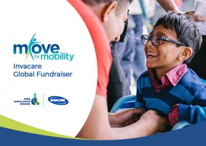 Image of a global fundraiser for mobility: a smiling child in a wheelchair, assisted by another person.